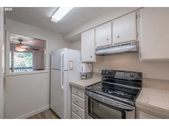 a balcony with wooden floor and fence
