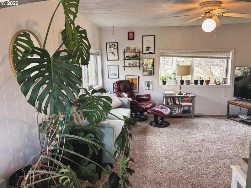 102 Idaho Street Mosier, OR 97040 - Photo 31 of 32 a view of a livingroom with furniture and a potted plant