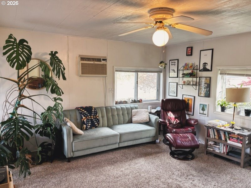 102 Idaho Street Mosier, OR 97040 - Photo 32 of 32 a living room with furniture a chandelier and a potted plant