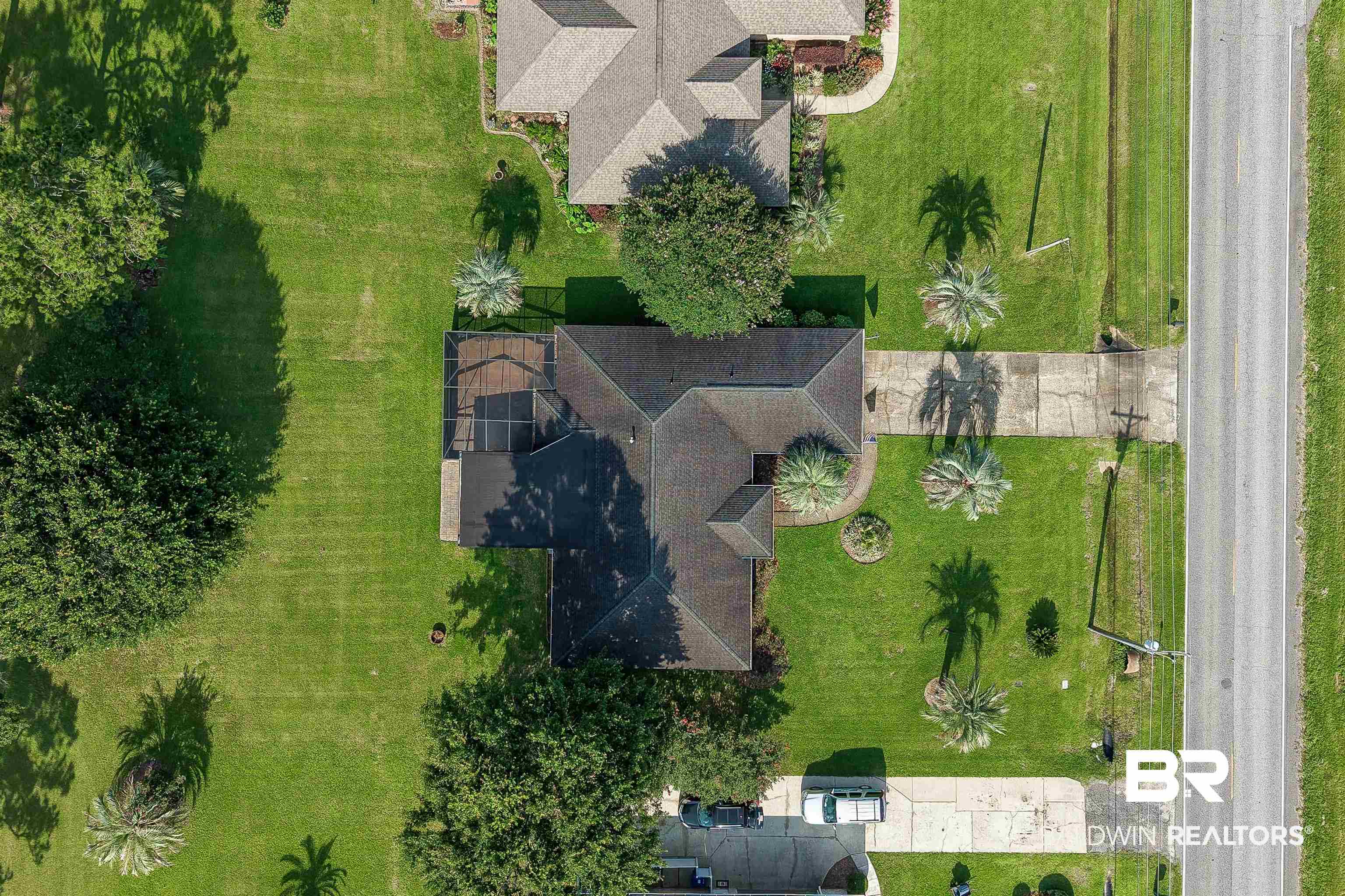 22685 County Road 12 Foley, AL 36535 - Photo 80 of 89 Aerial perspective showcasing a single-story residence with a multi-gabled roof and an attached screened enclosure