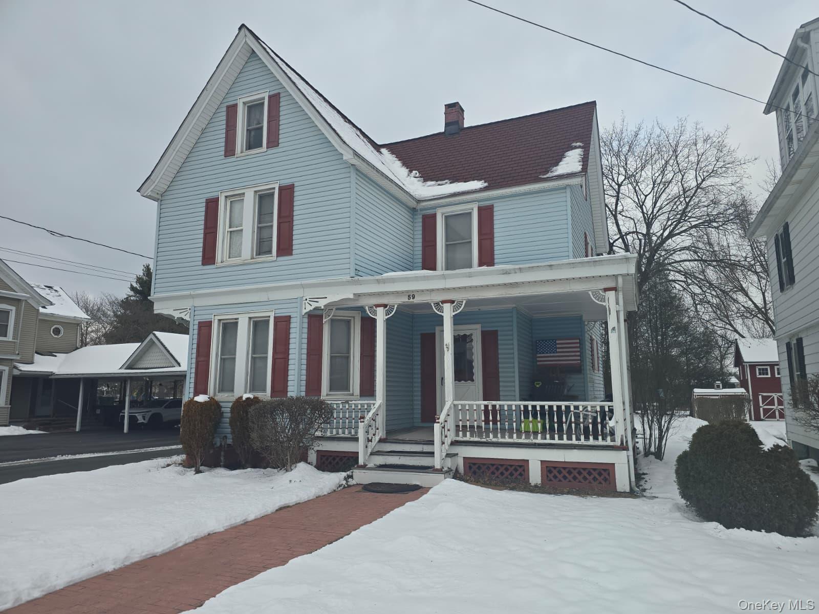 59 Bridge Street, Unit 2 Wallkill, NY 12589 - Photo 1 of 14 View of front of home with a porch and a chimney