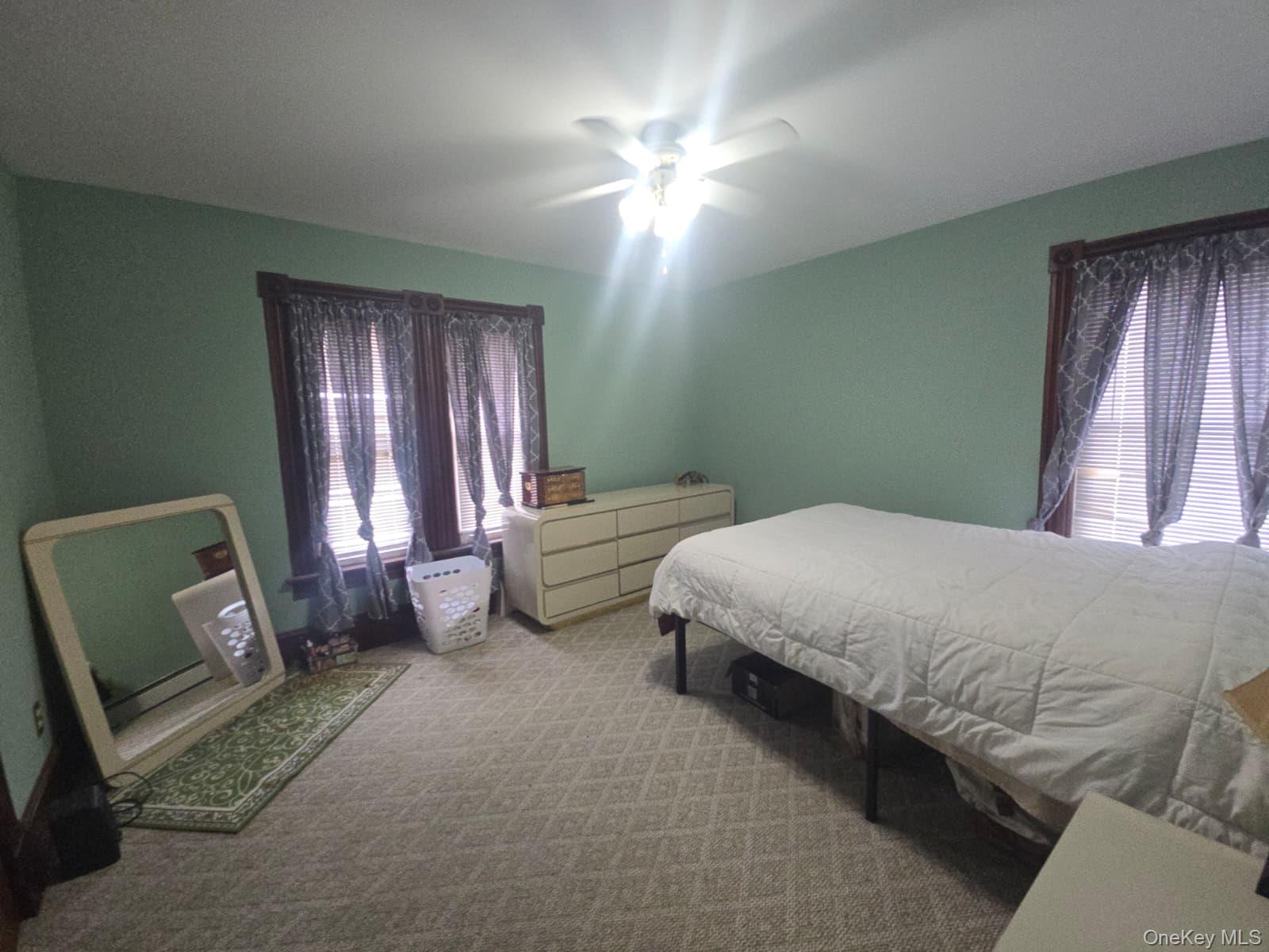 59 Bridge Street, Unit 2 Wallkill, NY 12589 - Photo 10 of 14 Bedroom featuring carpet floors and a ceiling fan