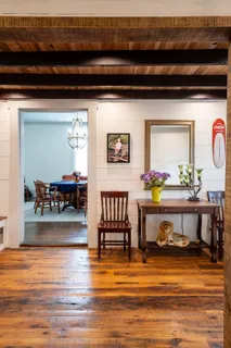 a living room with furniture and flowers