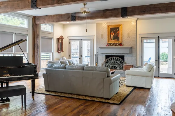 a bedroom with furniture and wooden floor