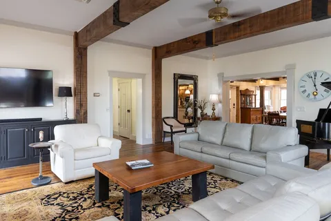 a spacious bedroom with a bed and a fireplace