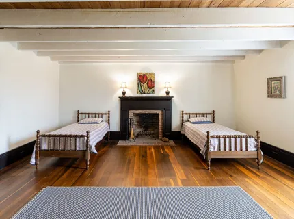 a front view of a house with outdoor seating