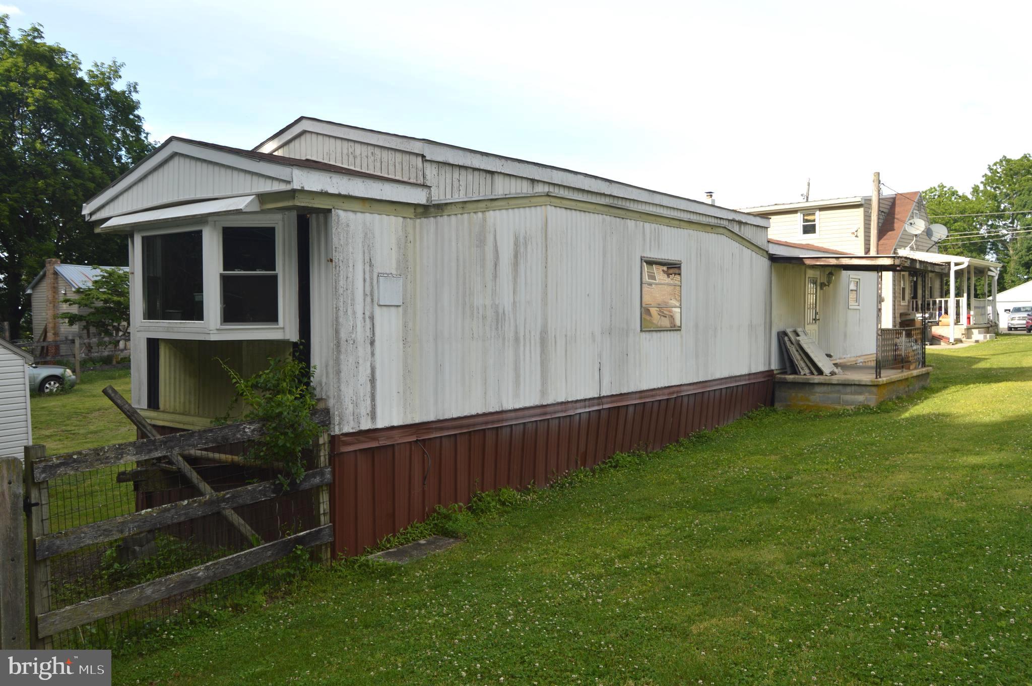 46 Mountain Spring Road Blandon, PA 19510 - Photo 16 of 18 a backyard of a house with wooden fence