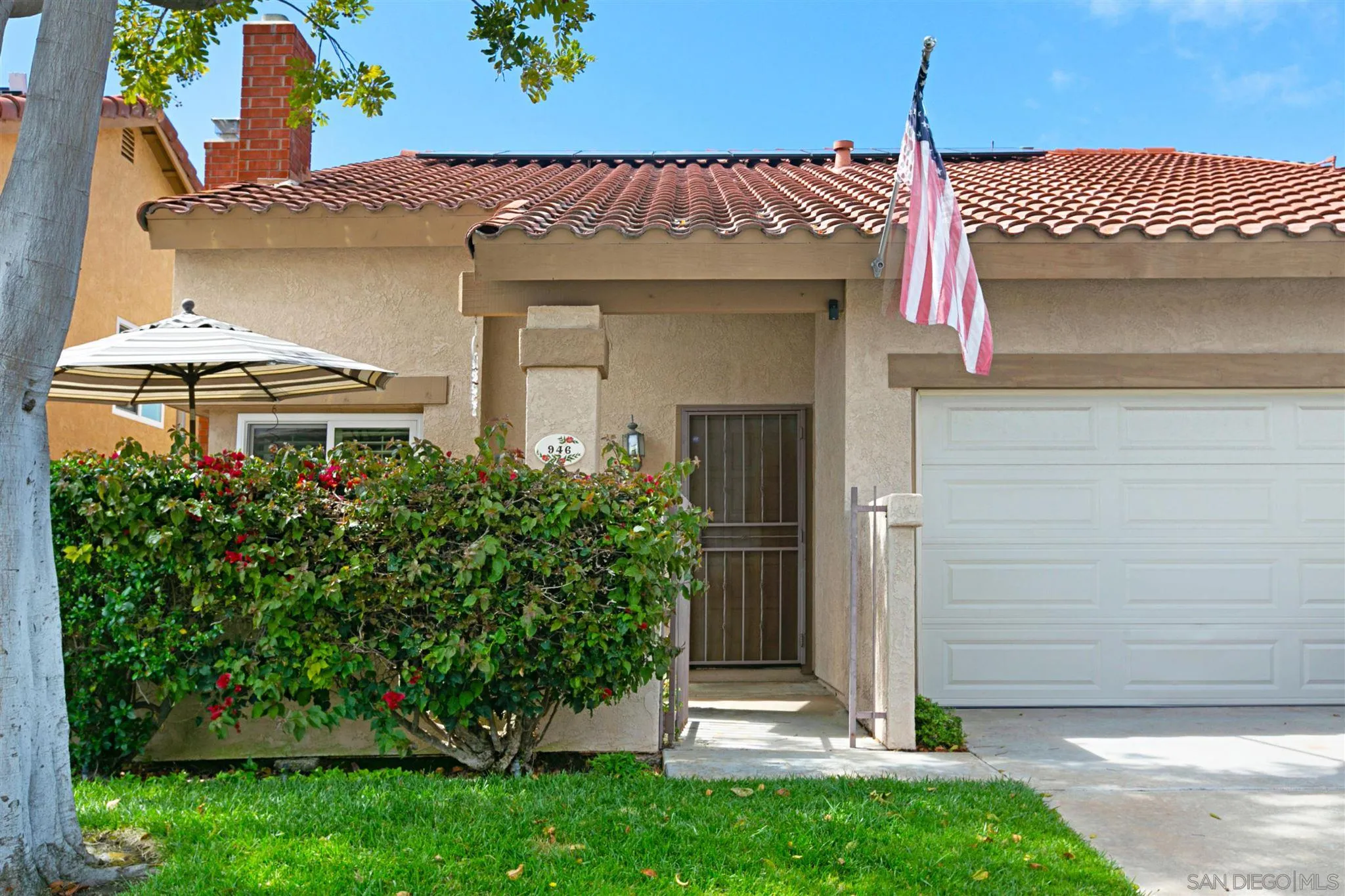 946 Alyssum Road Carlsbad, CA 92011 - Photo 1 of 19 a front view of a house with a yard