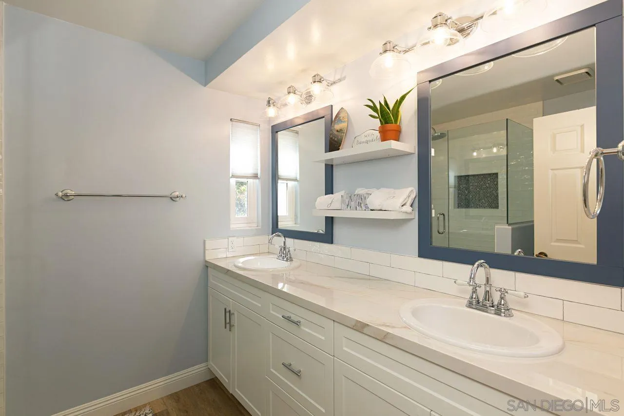 946 Alyssum Road Carlsbad, CA 92011 - Photo 12 of 19 a bathroom with a sink and a mirror
