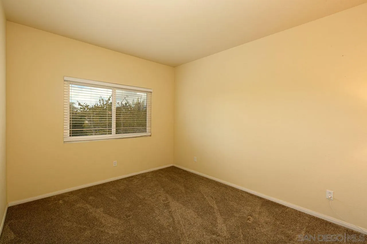 946 Alyssum Road Carlsbad, CA 92011 - Photo 16 of 19 a view of an empty room with a window