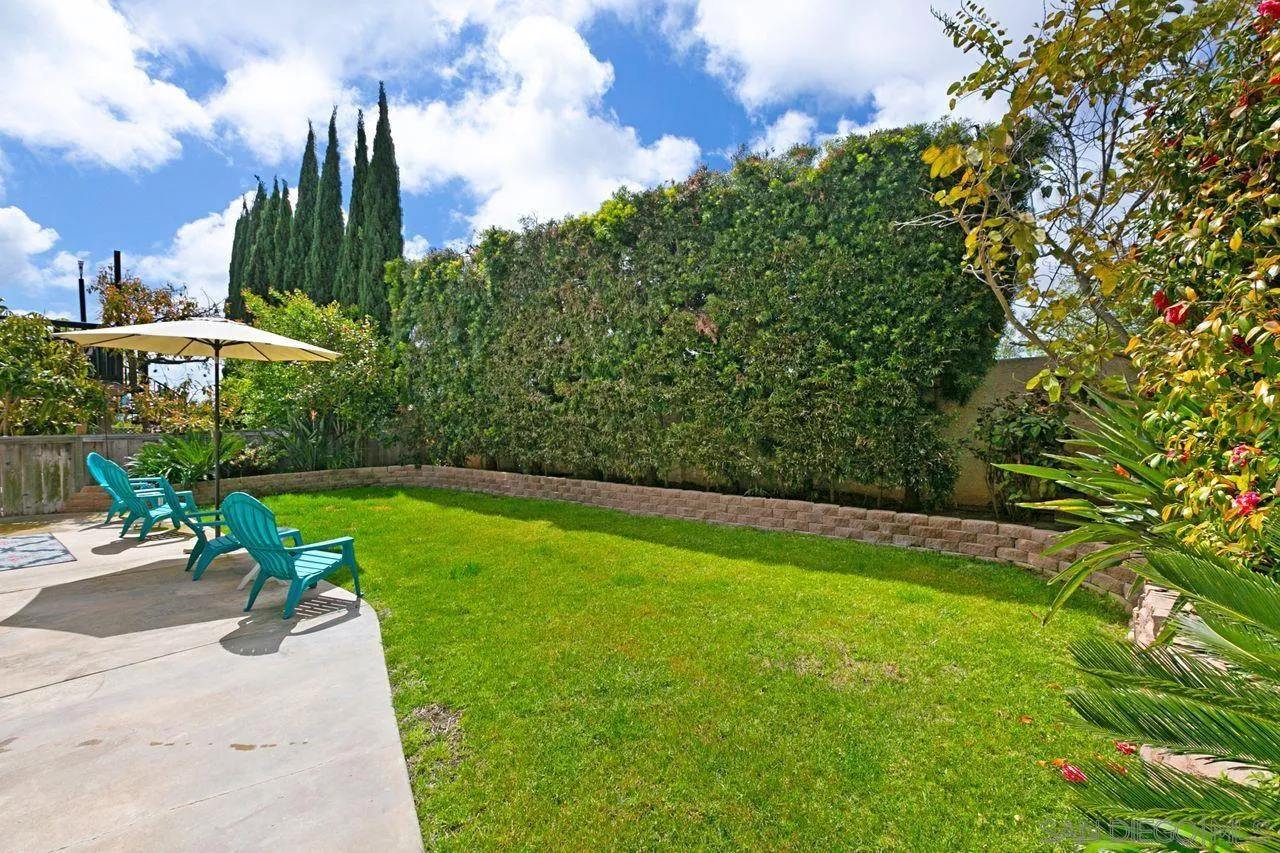 946 Alyssum Road Carlsbad, CA 92011 - Photo 17 of 19 a view of a garden with a building in the background