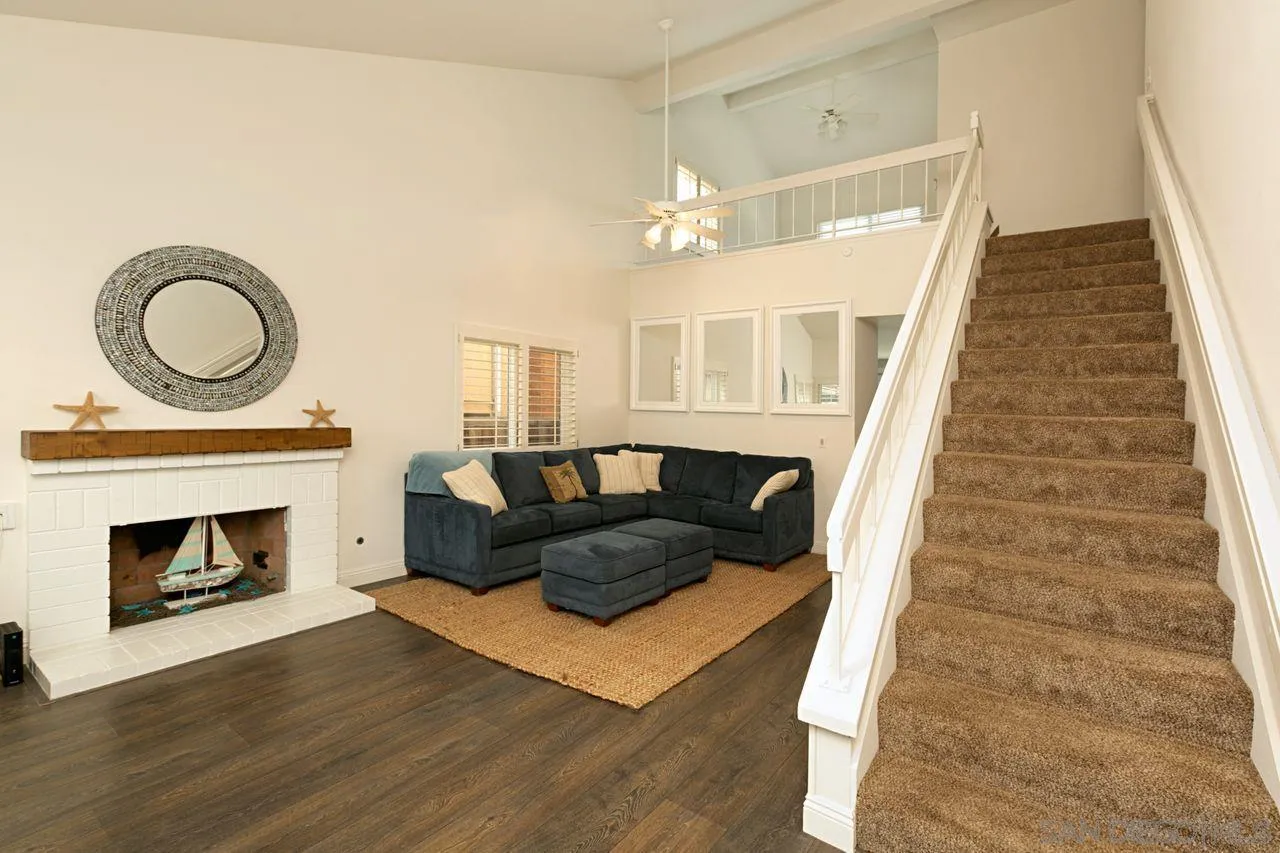 946 Alyssum Road Carlsbad, CA 92011 - Photo 4 of 19 a living room with furniture and a fireplace
