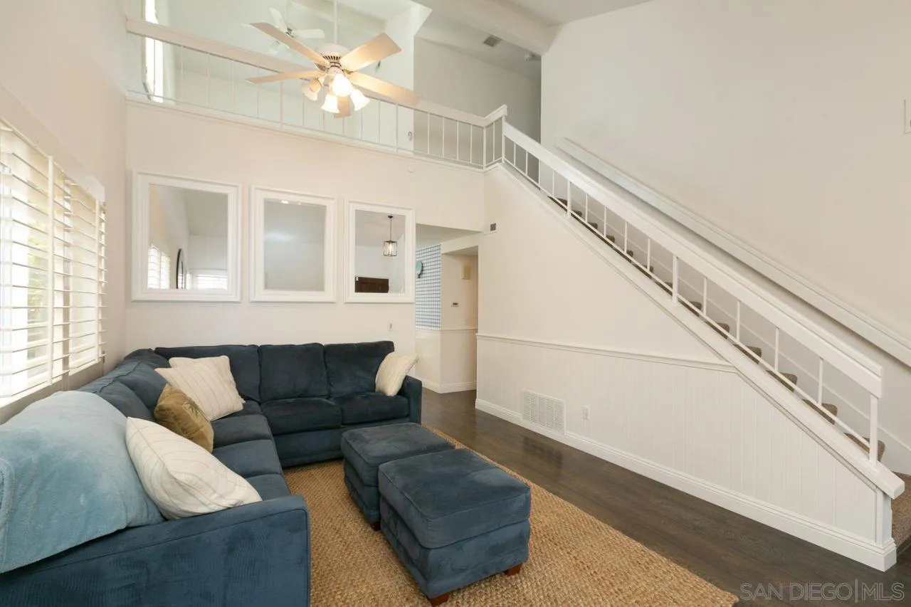 946 Alyssum Road Carlsbad, CA 92011 - Photo 5 of 19 a living room with furniture and a rug