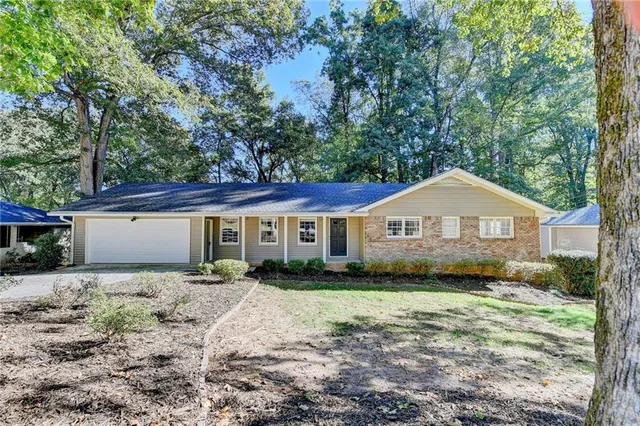 a front view of a house with yard