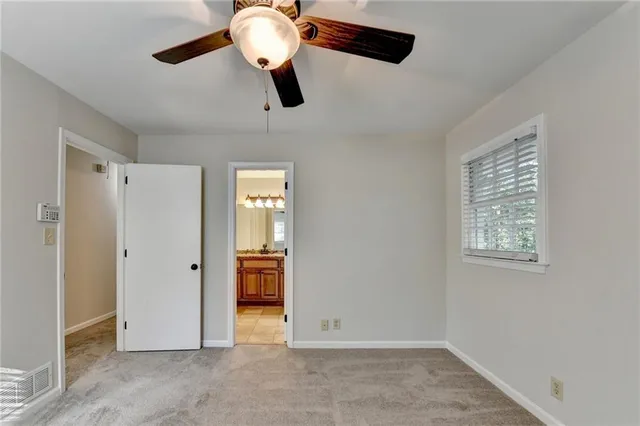 a view of an empty room and wooden floor