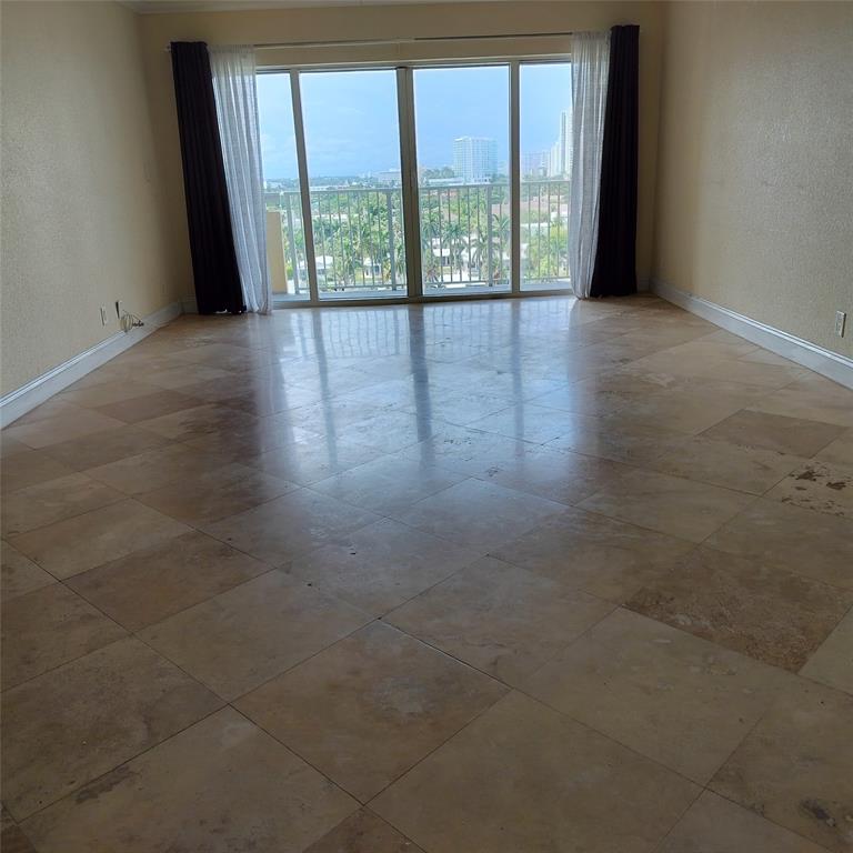 1200 Hibiscus Avenue, Unit 903 Pompano Beach, FL 33062 - Photo 6 of 20 a view of an empty room with a window