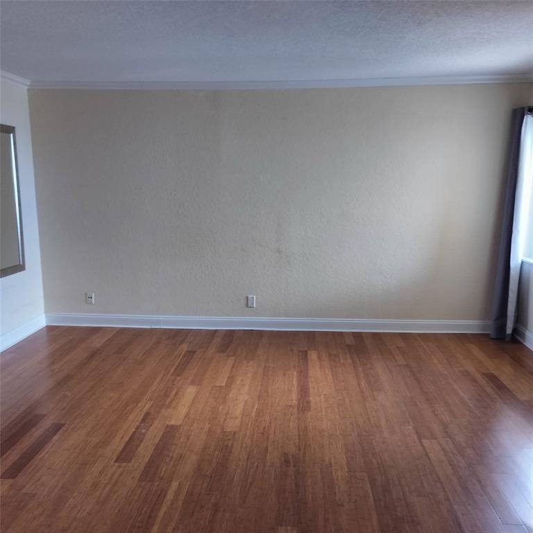 1200 Hibiscus Avenue, Unit 903 Pompano Beach, FL 33062 - Photo 9 of 20 a view of a room with wooden floor