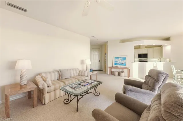 a living room with furniture and a couch