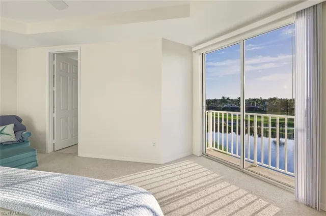 a view of a bedroom with wooden floor
