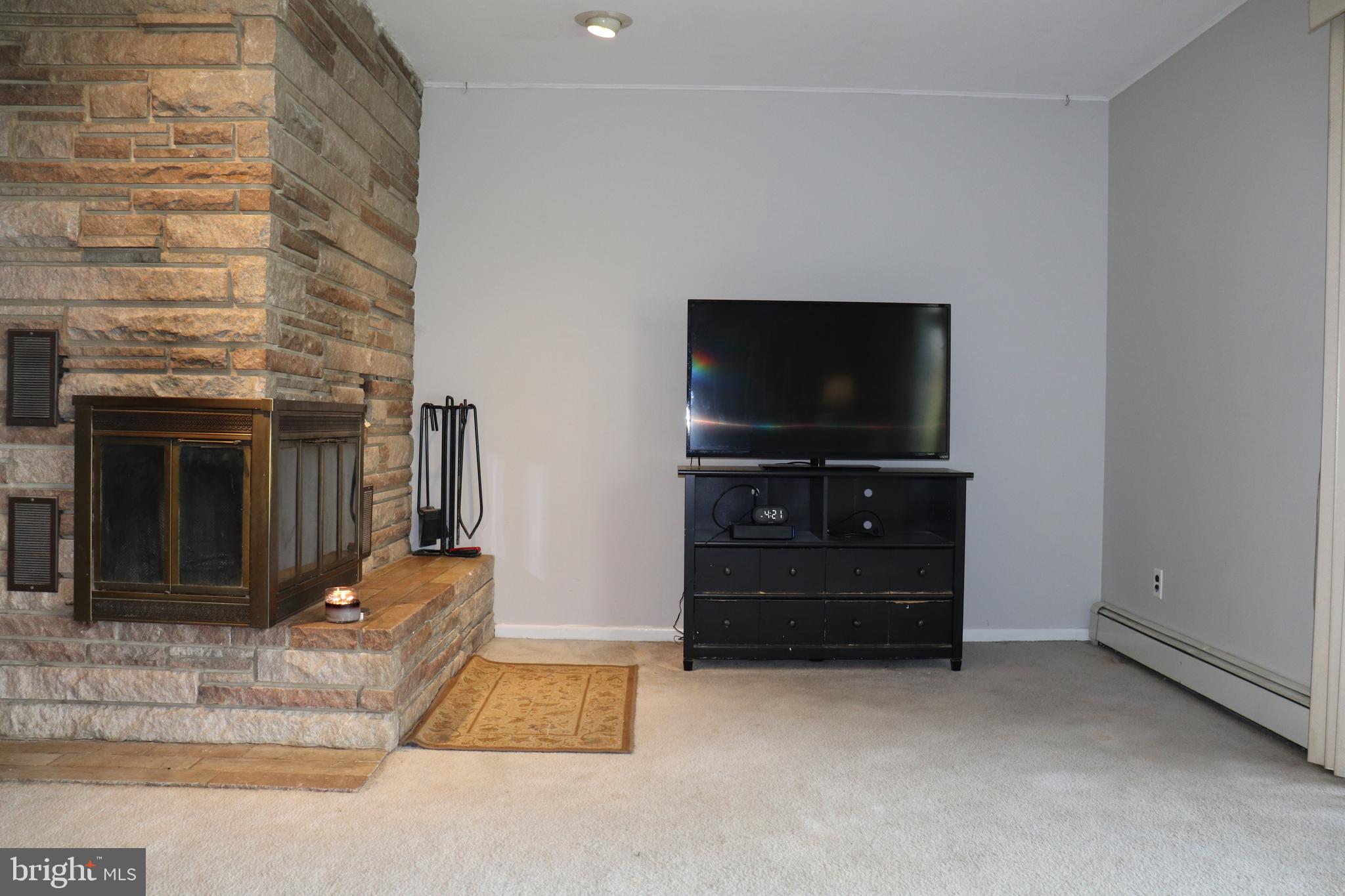 168 Line Road Princeton Junction, NJ 08550 - Photo 9 of 17 Living room with working corner fireplace