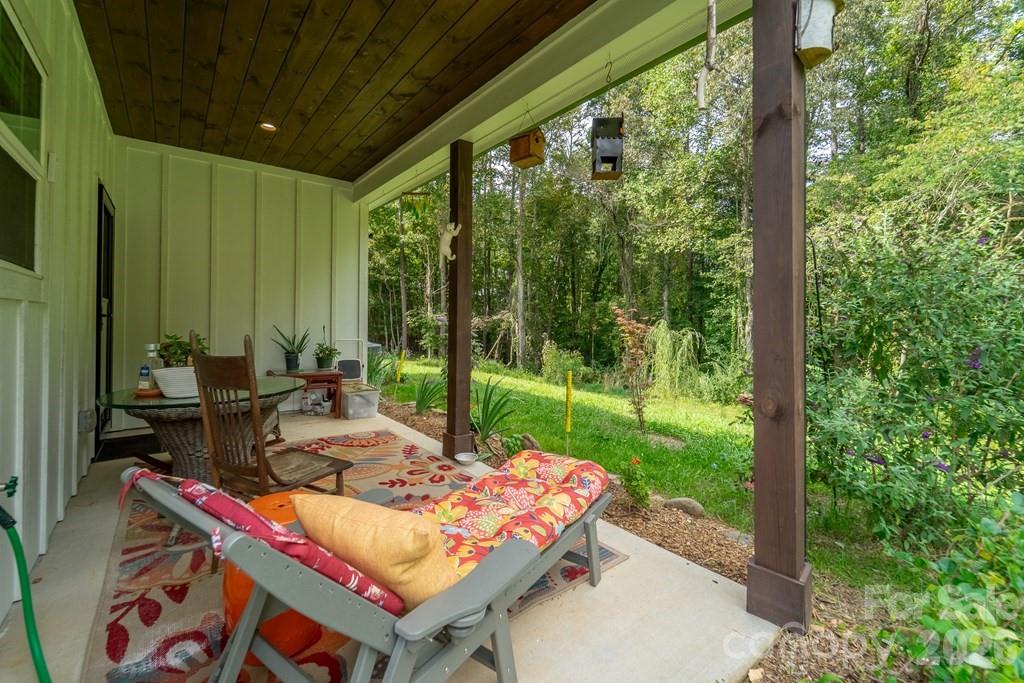 190 Fort Hembree Road Hayesville, NC 28904 - Photo 18 of 18 a backyard of a house with outdoor seating