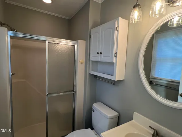 a bathroom with a toilet and a sink