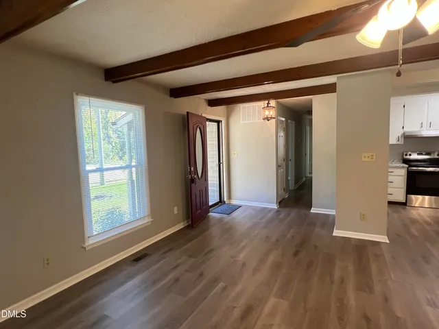 a view of livingroom with hardwood floor and hallway