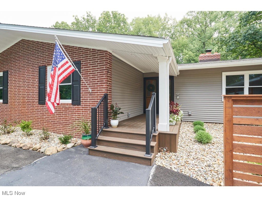 Entrance to property featuring a porch