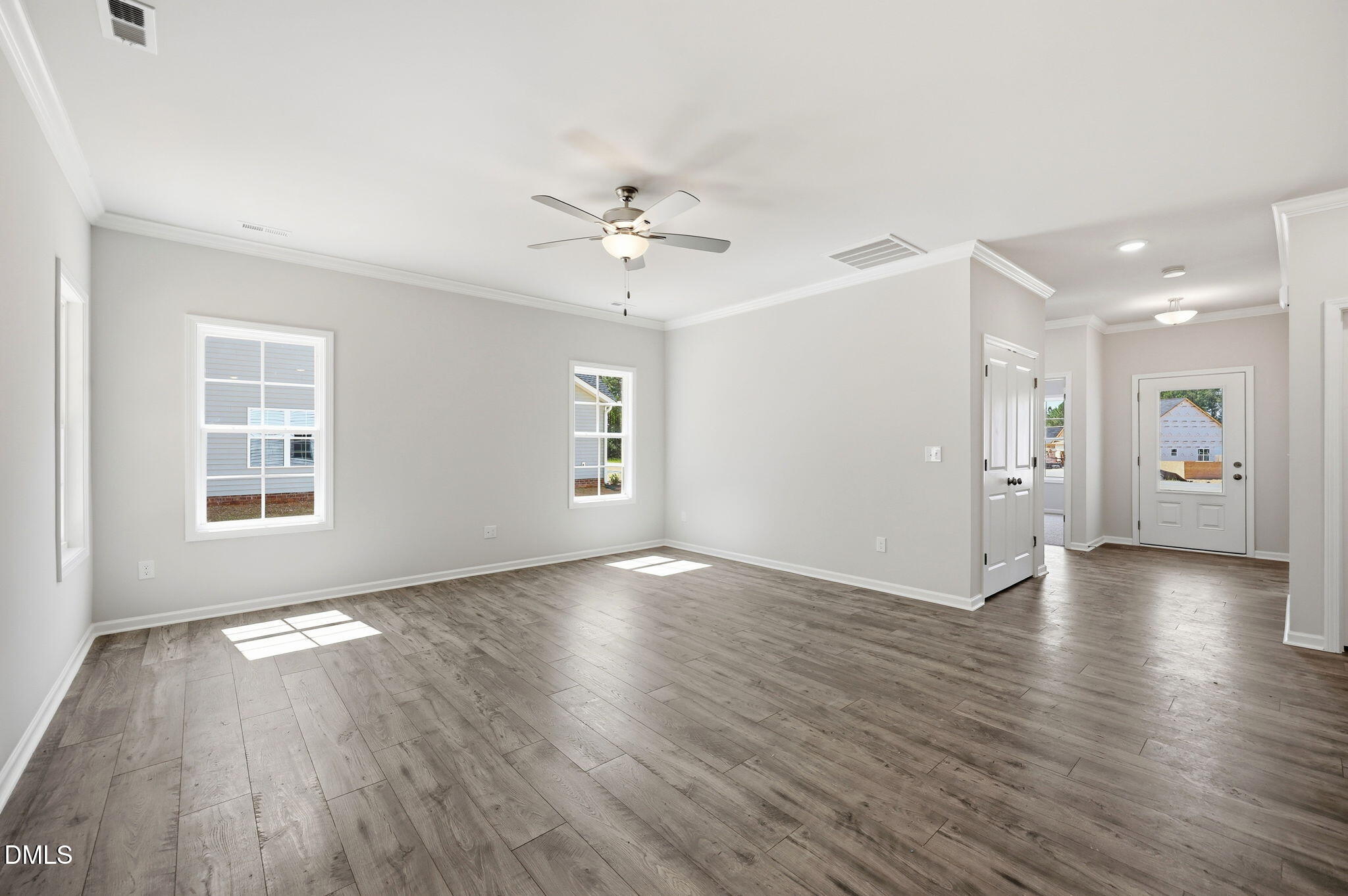 191 Nectar Lane Bunnlevel, NC 28323 - Photo 16 of 35 a view of an empty room with a window and wooden floor