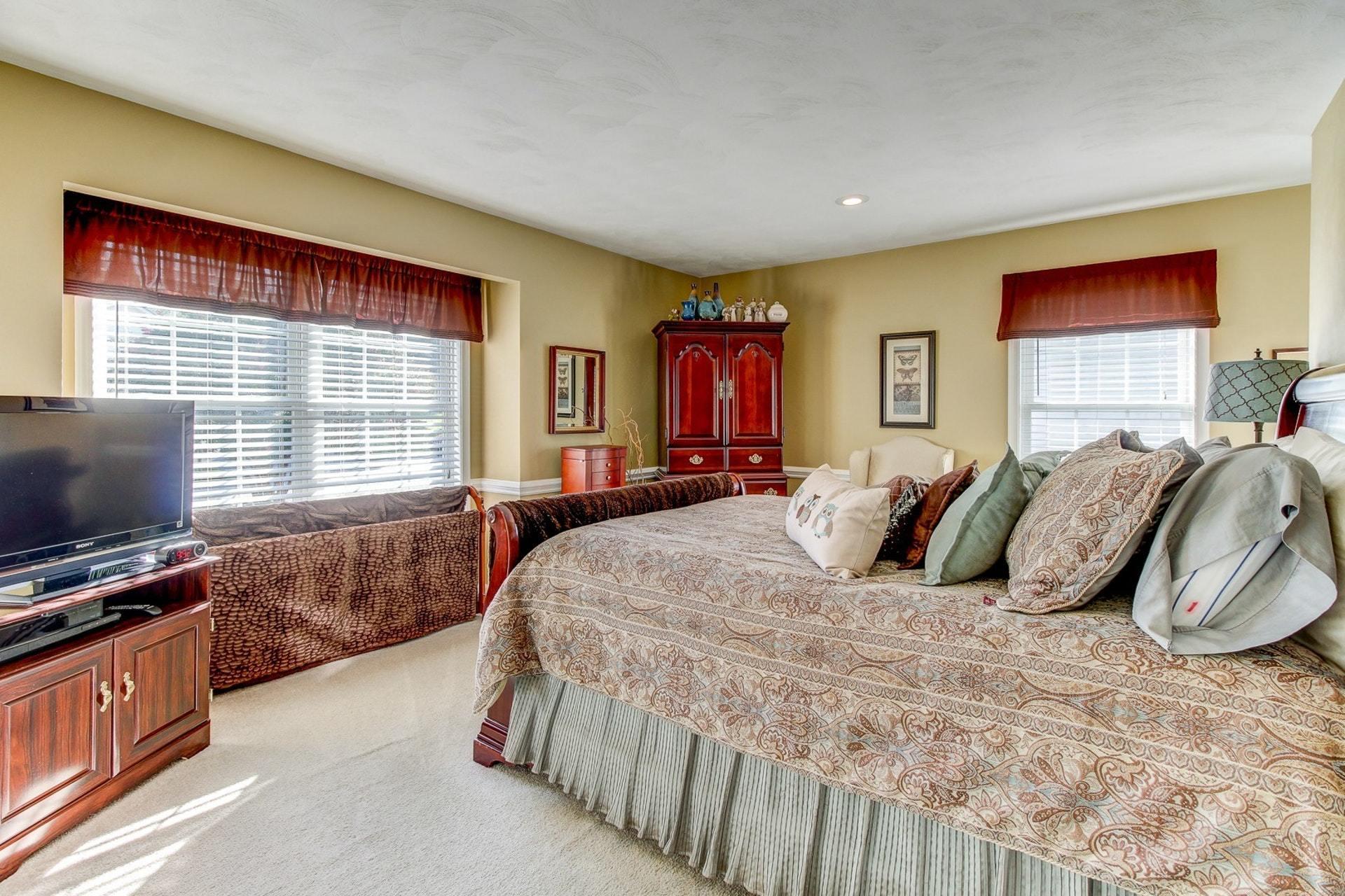 1737 Meadows Road Vinton, VA 24179 - Photo 11 of 37 a bedroom with a bed and a flat screen tv