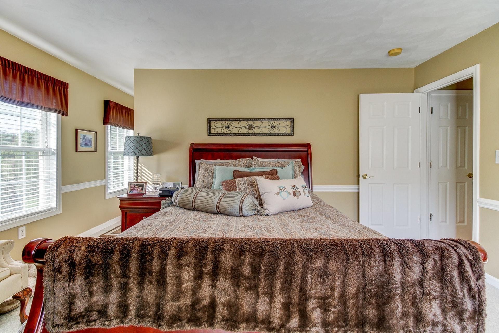 1737 Meadows Road Vinton, VA 24179 - Photo 12 of 37 a bedroom with a bed and wooden floor
