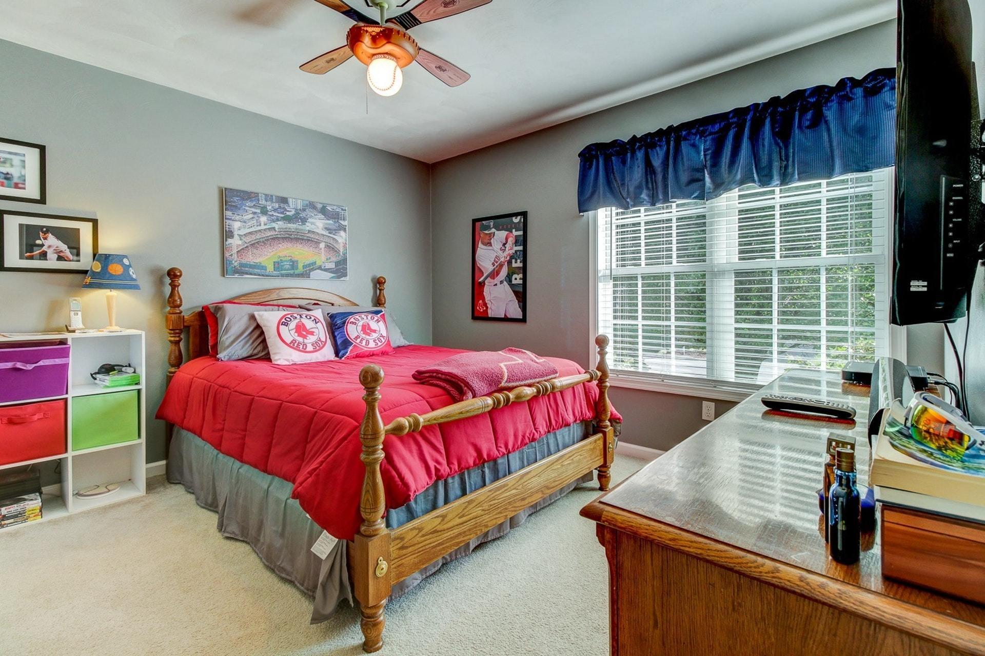 1737 Meadows Road Vinton, VA 24179 - Photo 17 of 37 a bedroom with a bed and a flat screen tv