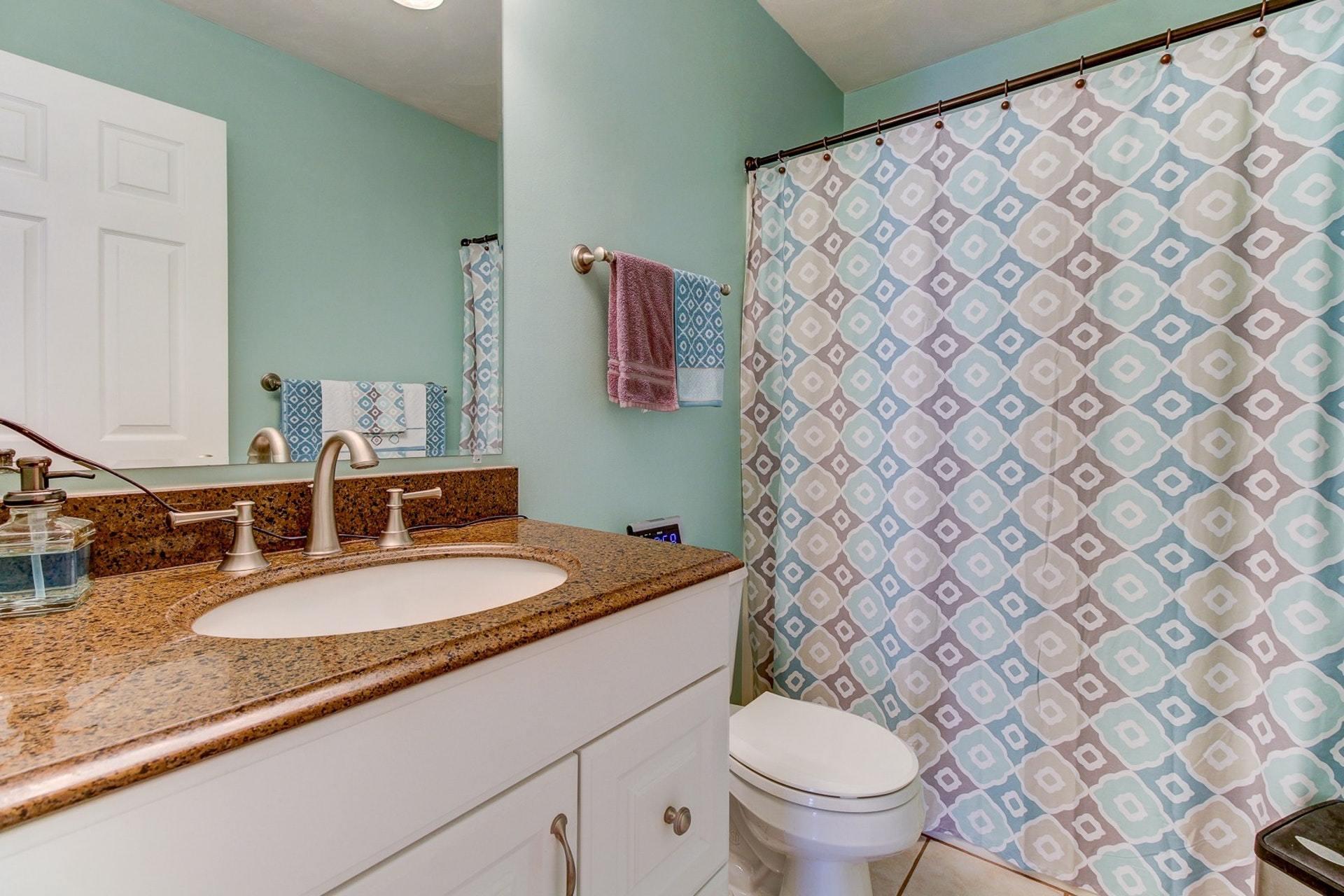 1737 Meadows Road Vinton, VA 24179 - Photo 18 of 37 a bathroom with a granite countertop sink and a mirror