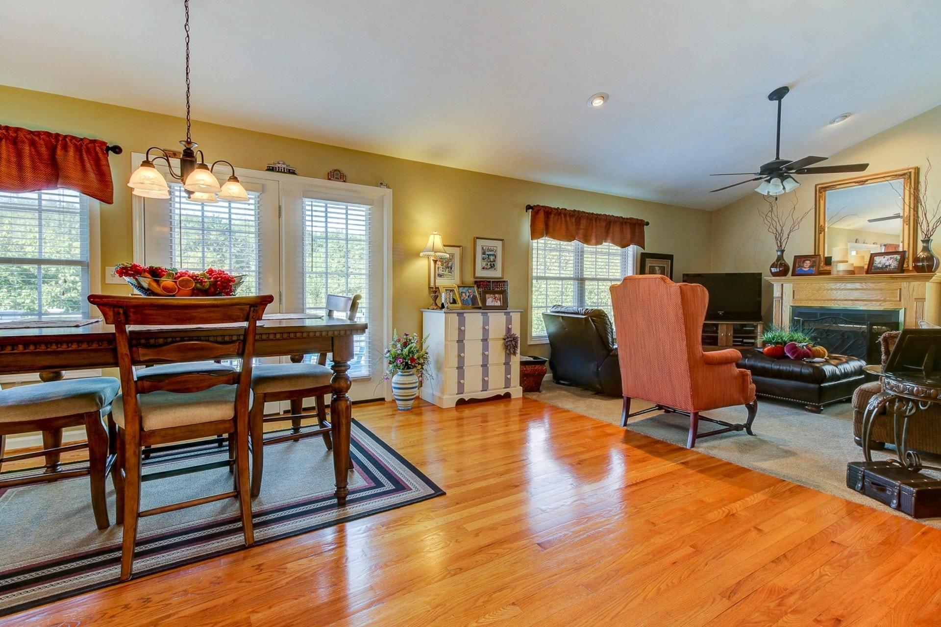 1737 Meadows Road Vinton, VA 24179 - Photo 4 of 37 a dining room with furniture a chandelier and wooden floor