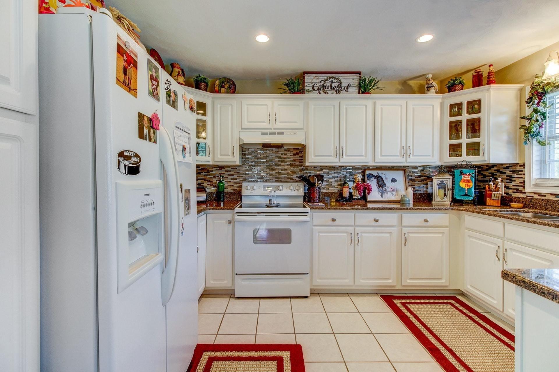1737 Meadows Road Vinton, VA 24179 - Photo 8 of 37 a kitchen with stainless steel appliances granite countertop a refrigerator and a stove top oven