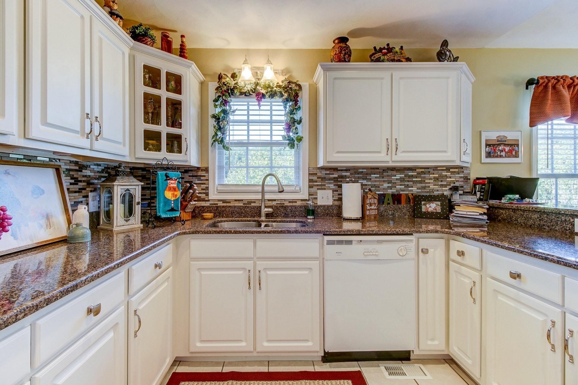 1737 Meadows Road Vinton, VA 24179 - Photo 9 of 37 a kitchen with stainless steel appliances granite countertop a sink and a white cabinets