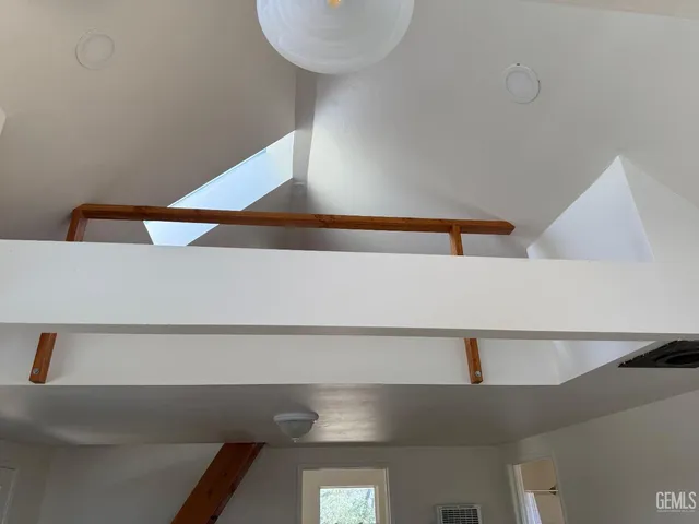 a bathroom with a sink a mirror and a window