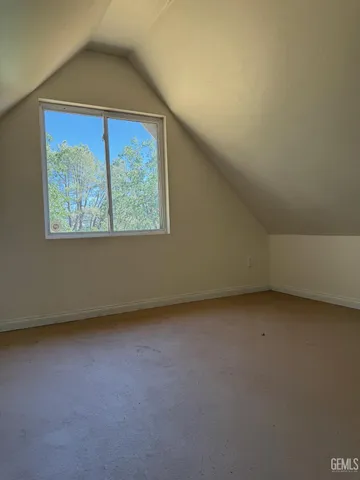 a big yard with lots of green space and deers