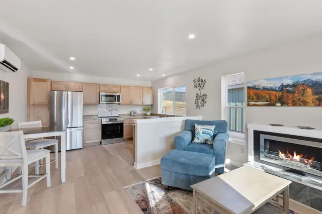 a living room with furniture and a fireplace