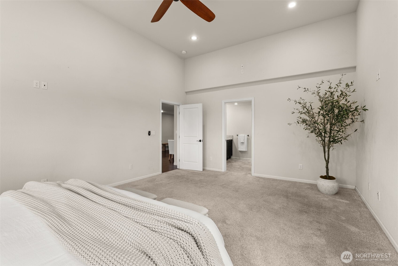 162 Southeast 16th Street Chehalis, WA 98532 - Photo 14 of 39 a bedroom with a large bed and a chandelier