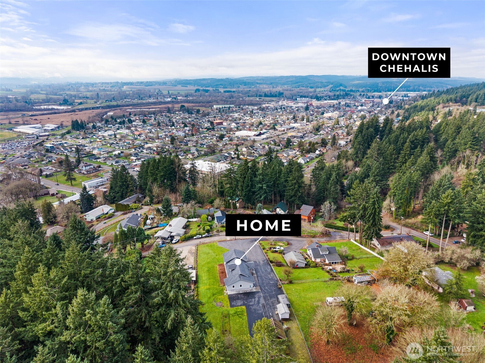 162 Southeast 16th Street Chehalis, WA 98532 - Photo 31 of 39 a view of a city with lush green forest
