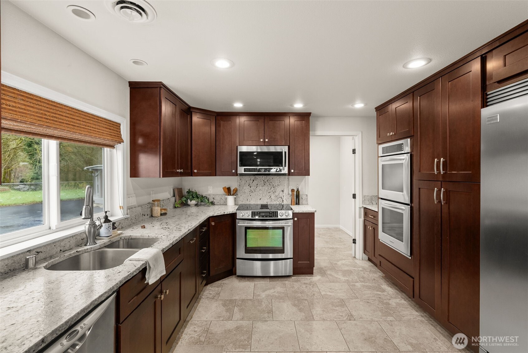 162 Southeast 16th Street Chehalis, WA 98532 - Photo 10 of 39 a kitchen with stainless steel appliances granite countertop a sink stove and refrigerator