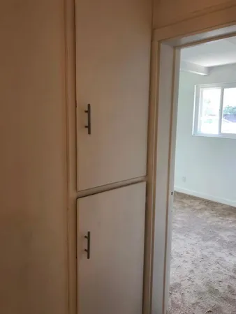 a view of a closet in a bathroom
