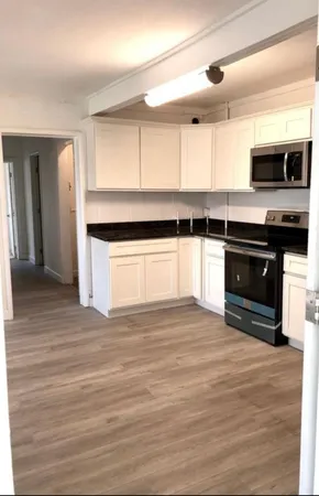 a kitchen with stainless steel appliances granite countertop a stove and a sink