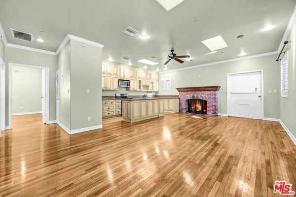 a bathroom with a granite countertop sink a toilet and a mirror