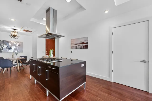 a kitchen with a stove and a refrigerator