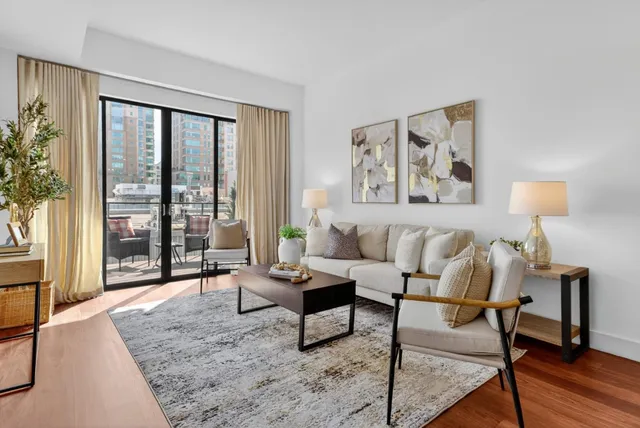 a living room with furniture or couch and a wooden floor