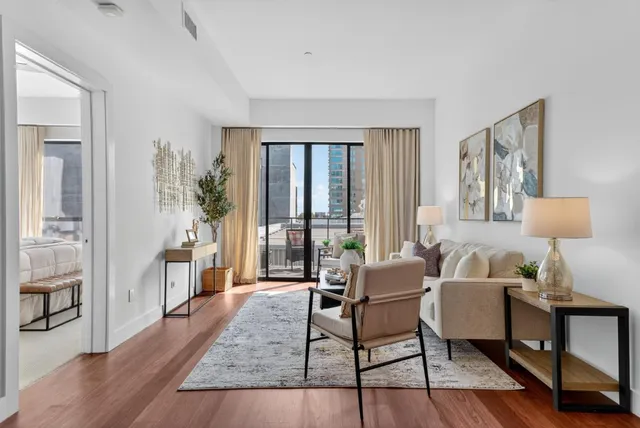 a view of bathroom with shower mirror and sink