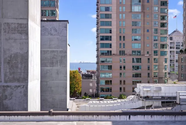 a view of parking garage with cars
