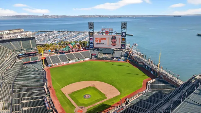 a view of a chairs and table on the roof deck